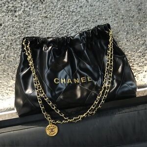 CHANEL Black Quilted Interior with Gold Accents